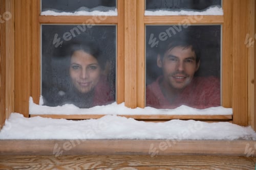 Preview: Mid Adult Couple Looking Through Window