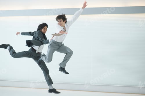 Preview: Two Businessmen Leaping In The Air, Competing To Be First