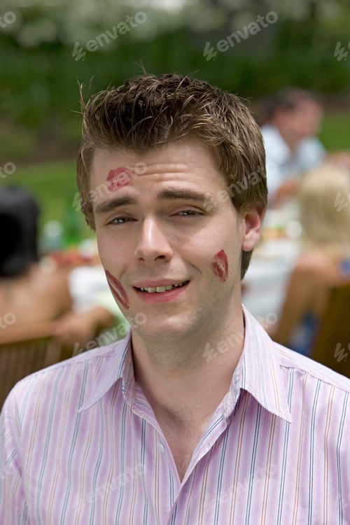 Preview: A Portrait Of A Young Man Covered In Lipstick Kisses