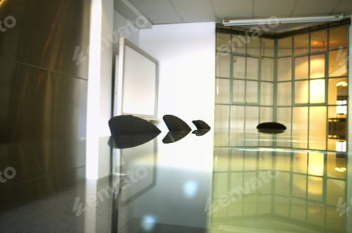 Preview: View Of A Metal Table And Chairs With Light Shining In Through A Door