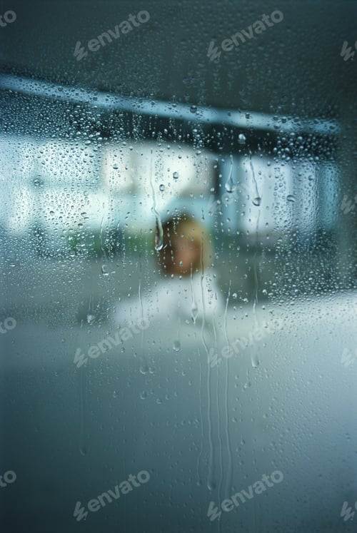 Preview: Woman On Sofa, Seen Through Rain-Streaked Window