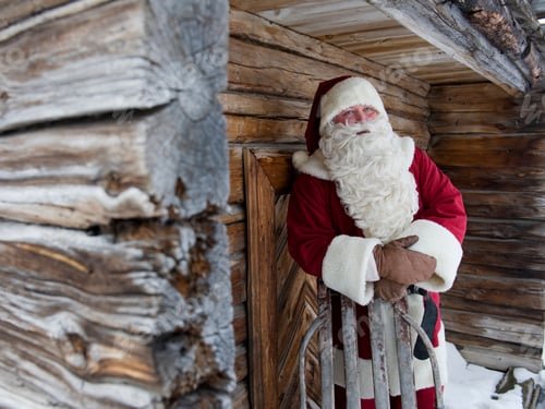 Preview: Santa Claus Standing Outside A Log Cabin