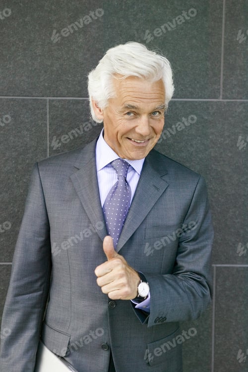 Preview: Senior Businessman Giving The Thumbs Up
