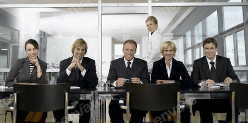 Preview: Businesspeople Smiling At Conference Table