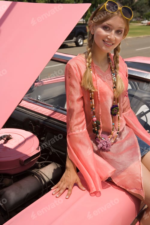 Preview: Woman Sitting On Old Fashioned Convertible Car