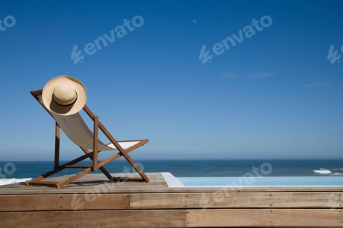 Preview: Empty Deck Chair Near Swimming Pool