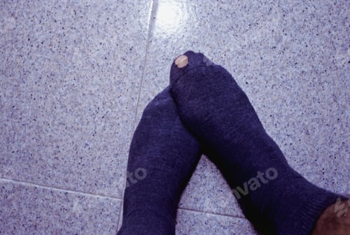 Preview: Man Standing In Socks, Focus On His Et