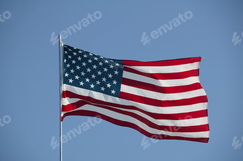 Preview: Detail View Of The Flag Of The United States Against Blue Sky