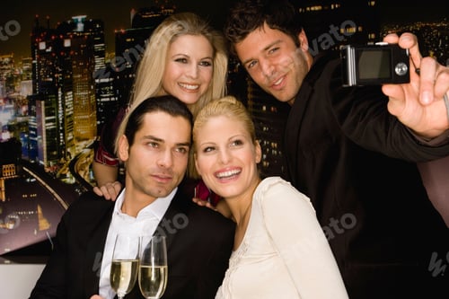 Preview: Young Couples Taking Picture At Party