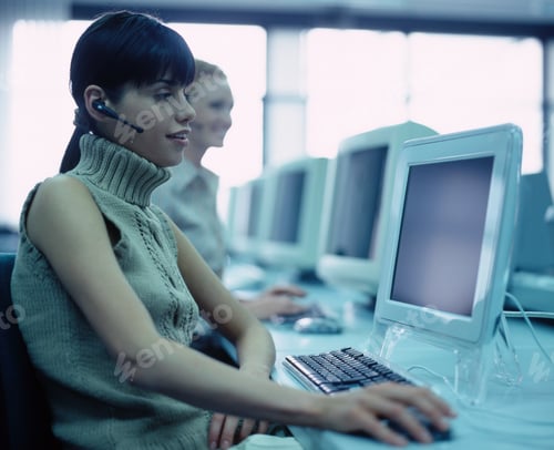 Preview: Woman With Headset Sitting In Call Centre