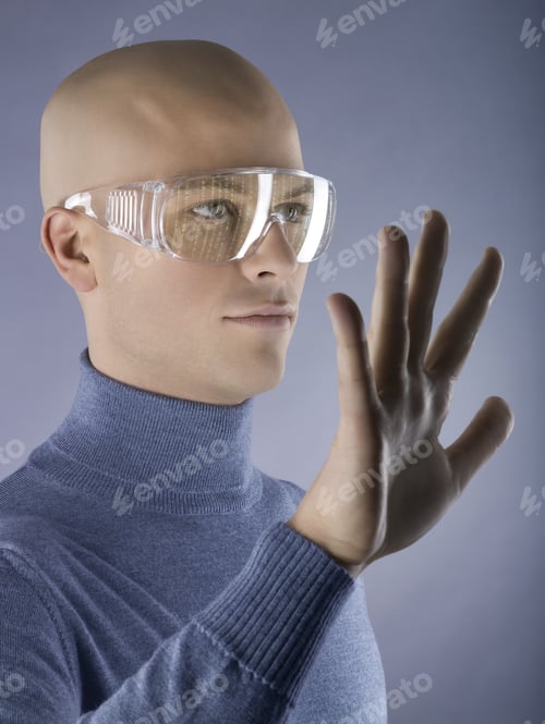 Preview: Man Wearing Goggles With Hand Up