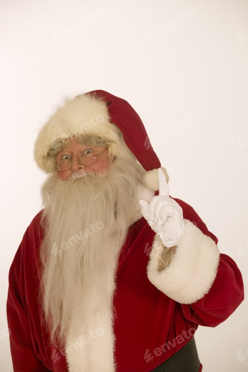 Preview: Studio Shot Of Santa Claus Holding Up His Index Finger