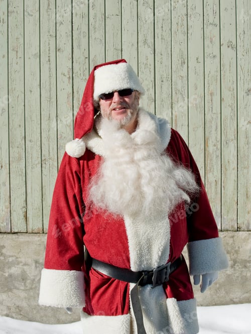 Preview: A Man Wearing A Santa Costume Standing In The Snow