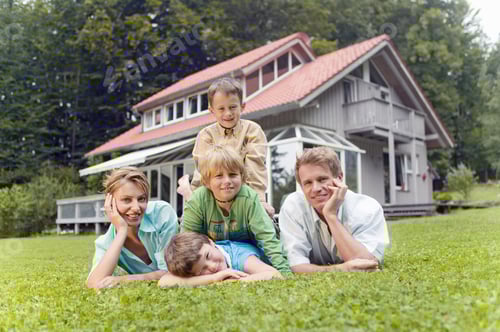 Preview: Portrait Of Young Family In Front Of House