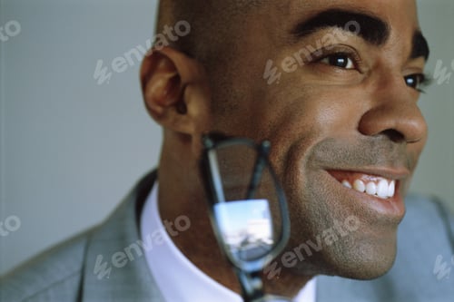 Preview: View Of Businessman Smiling With Glasses In The Foreground