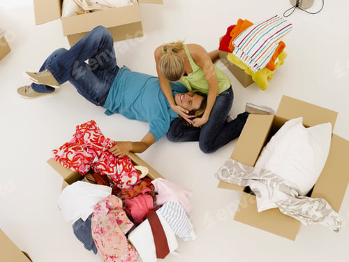 Preview: High Angle View Of Couple Surrounded By Moving Boxes