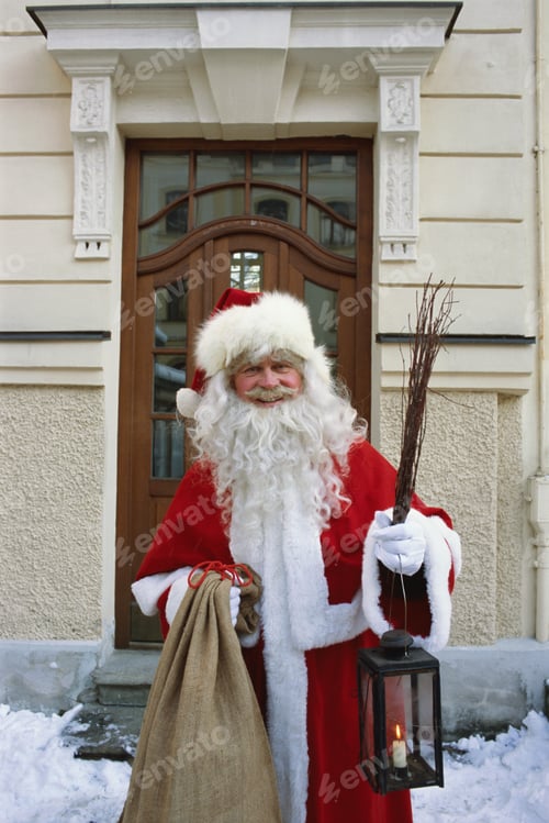Preview: Portrait Of A Man Dressed Up As Santa Claus Giving Presents To Two Young Children