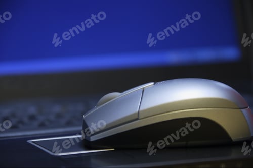 Preview: Computer Mouse Over Laptop Touch Pad