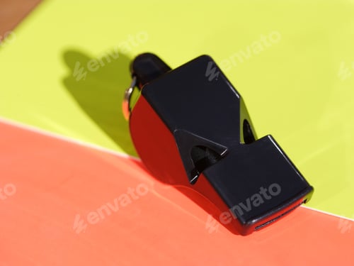 Preview: Close Up Of A Whistle On Red And Yellow Cards