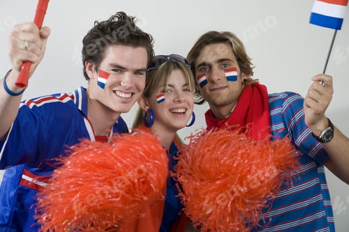Preview: Sports Fans With Flags Painted On Faces And Pom-Poms