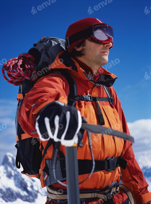 Preview: Low Angle View Of Hiker With Ice Axe Outdoors