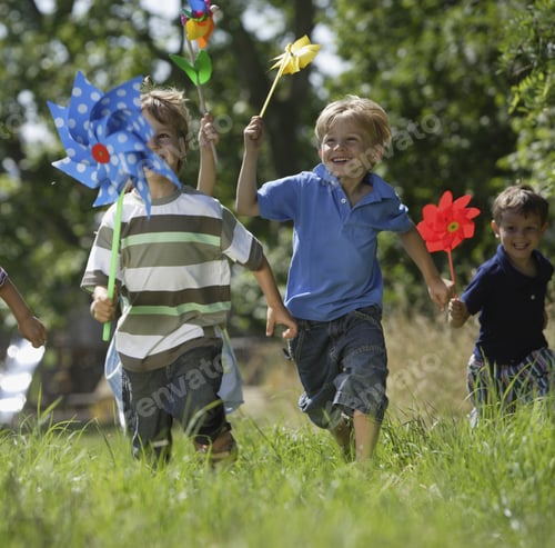 Preview: Group Of Children Playing With Pinwheels Outdoors