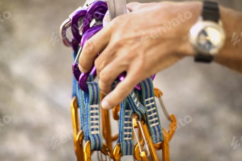 Preview: Detail View Of Hand Holding Rock Climbing Equipment
