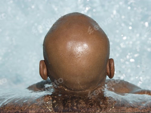 Preview: Back Of African Man’S Head In Swimming Pool