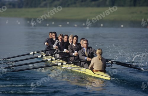 Preview: Team Of Rowers In Business Suits