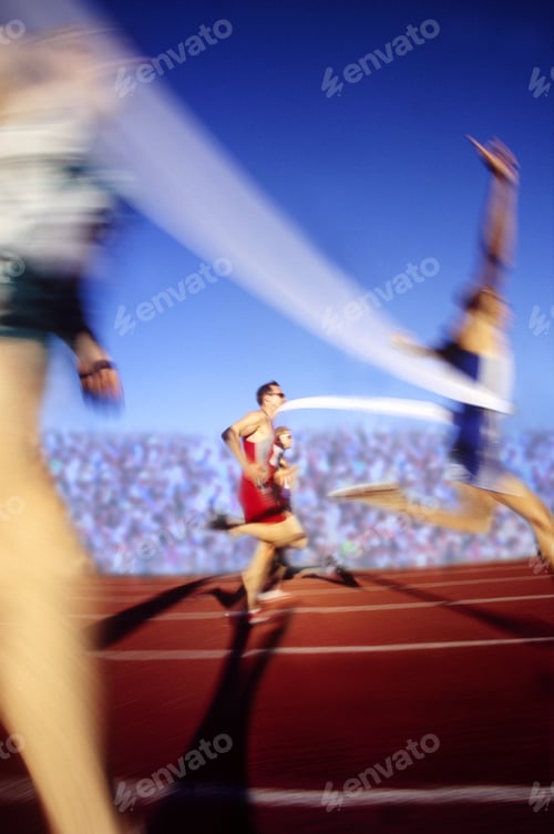 Preview: Blurred View Of An Athlete Crossing The Finish Line