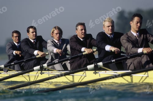 Preview: Team Of Rowers In Business Suits