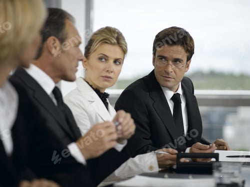 Preview: Businesspeople Having Meeting At Conference Table