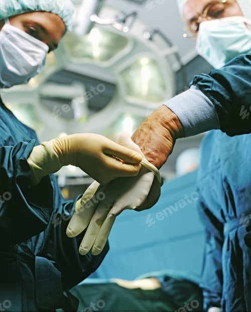 Preview: Nurse Helping Doctor Into Gloves