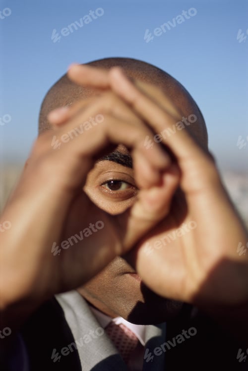 Preview: View Of Man´S Eye Through Circle Made With His Hands