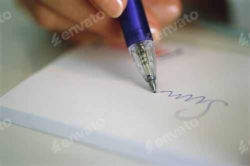 Preview: High Angle Detail View Of A Person Writing
