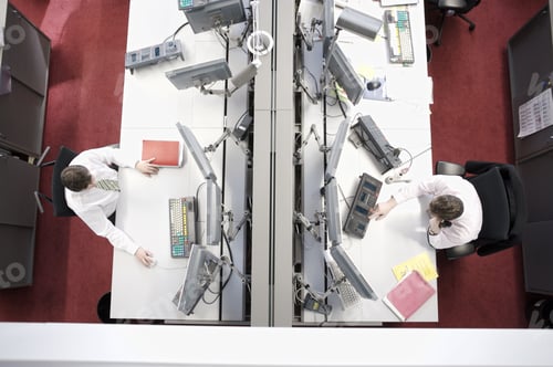 Preview: High Angle View Of Businessmen At Computer Work Stations