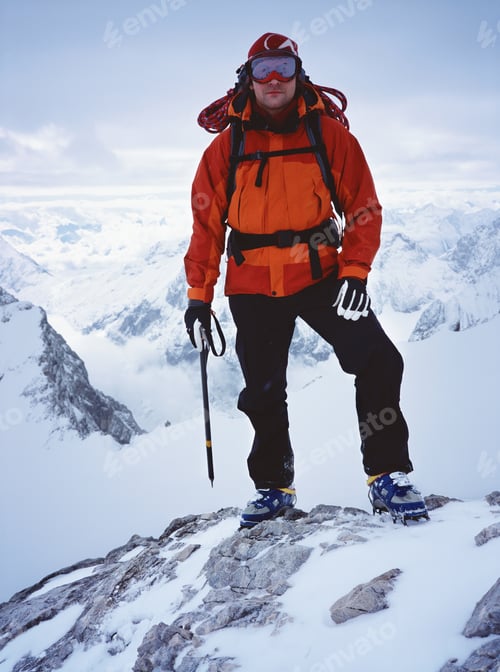 Preview: Male Hiker Standing On Snowy Mountain