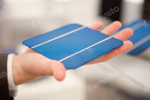 Preview: Close-Up Of Man Holding Solar Panel Chip