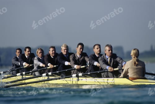 Preview: Team Of Rowers In Business Suits