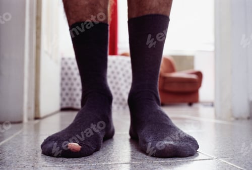 Preview: Man Standing In Socks, Focus On His Et