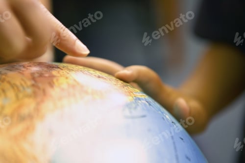 Preview: View Of Hands On A Globe