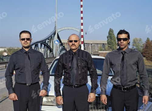 Preview: Three Men Dressed All In Black At Border Crossing