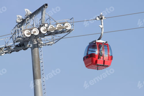 Preview: Red Cable Car Above Ski Slope