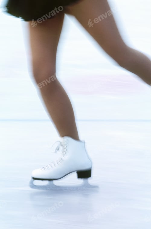 Preview: Blurred View Of A Woman Skating With White Ice Skates