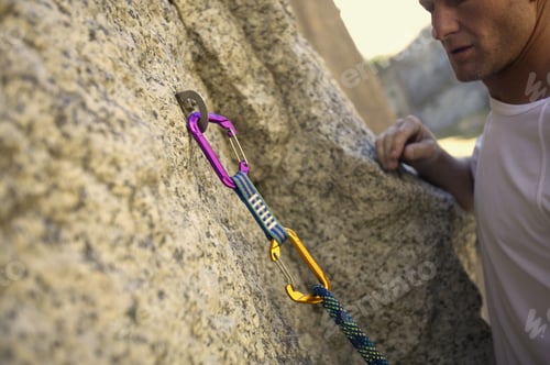Preview: View Of A Hook In The Side Of A Rock Holding A Rope