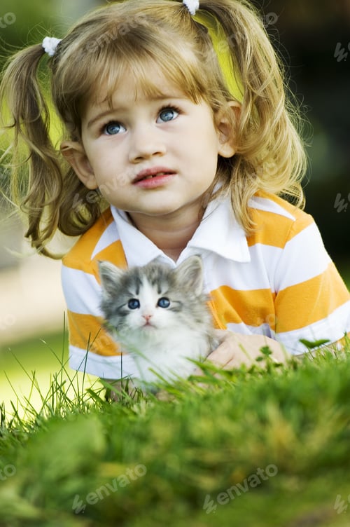 Preview: Young Girl In Grass With Kitten
