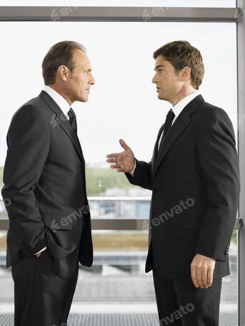 Preview: Two Businessmen Talking In Office