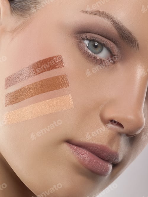 Preview: Portrait Of Young Woman With Strips Of Make-Up Foundation On Face