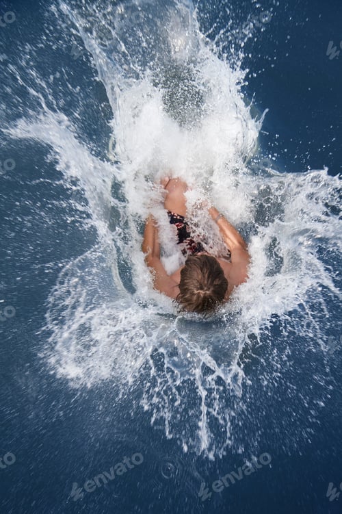 Preview: Girl Splashing Into Sea, High Angle View