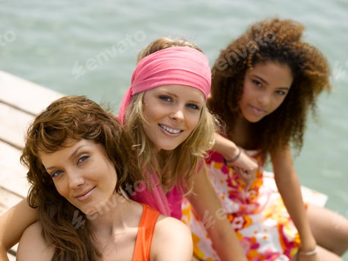 Preview: Multi-Ethnic Women Sitting On Pier